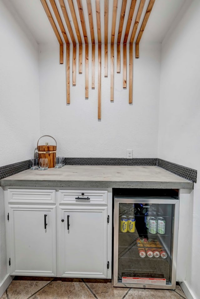 3513 Stanolind Ave, Midland, TX 79707 - indoor dry bar with beverage cooler and tile patterned flooring