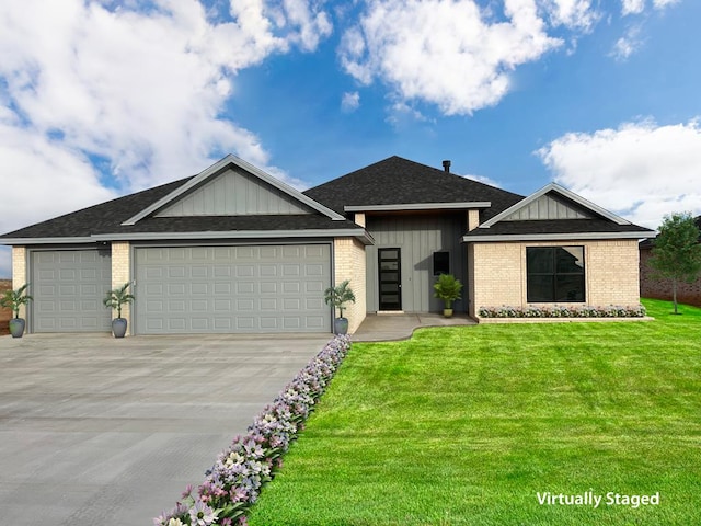 view of front of home with a garage and a front lawn