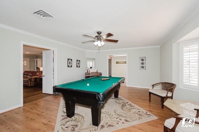 recreation room with pool table, a ceiling fan, visible vents, light wood finished floors, and crown molding