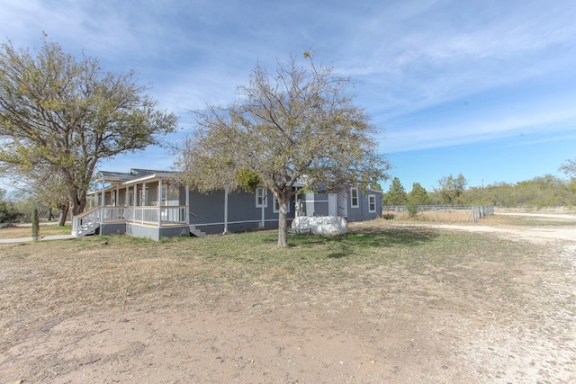 view of front of home with a sunroom