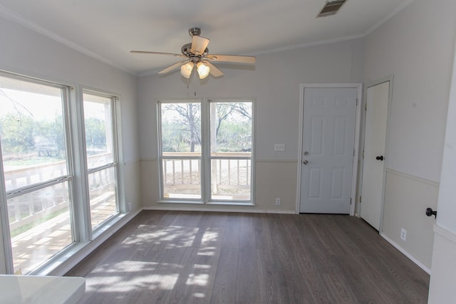 unfurnished room with dark hardwood / wood-style floors, ceiling fan, and ornamental molding