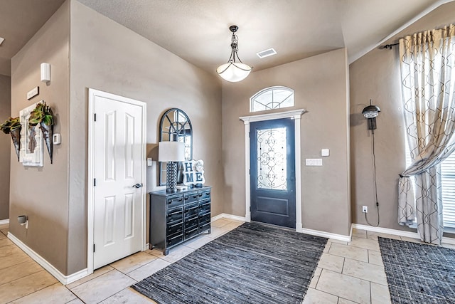 entryway featuring a textured ceiling