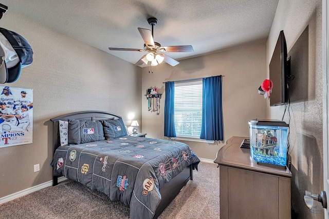 bedroom featuring ceiling fan, carpet floors, and a textured ceiling