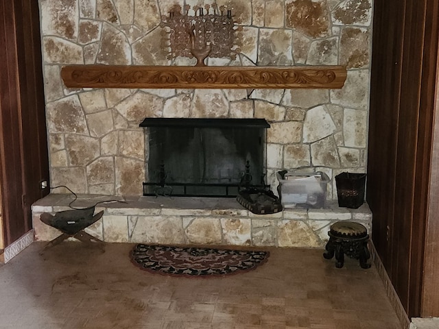 details with hardwood / wood-style flooring and a fireplace