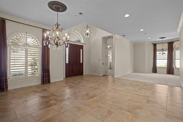 foyer entrance featuring an inviting chandelier, visible vents, crown molding, and recessed lighting