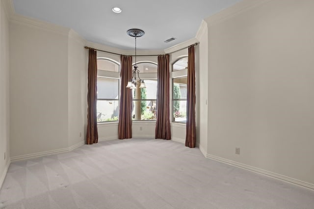 spare room with ornamental molding, baseboards, visible vents, and carpet flooring