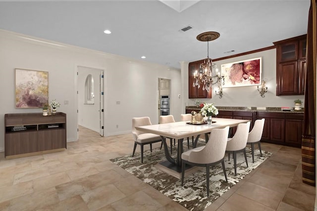 dining space with recessed lighting, visible vents, an inviting chandelier, ornamental molding, and baseboards