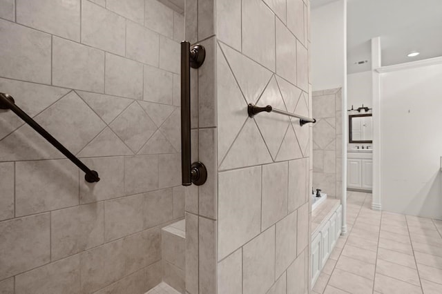 bathroom featuring tile patterned flooring, a washtub, and a tile shower