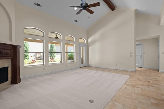 unfurnished living room featuring baseboards, visible vents, a fireplace, high vaulted ceiling, and beam ceiling