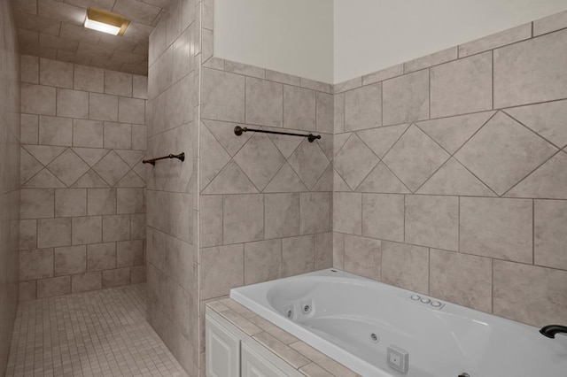 full bathroom featuring tiled shower and a whirlpool tub