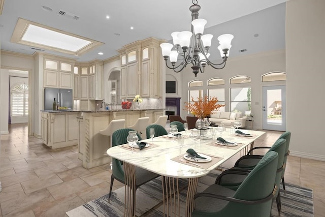 dining room with visible vents, ornamental molding, and baseboards