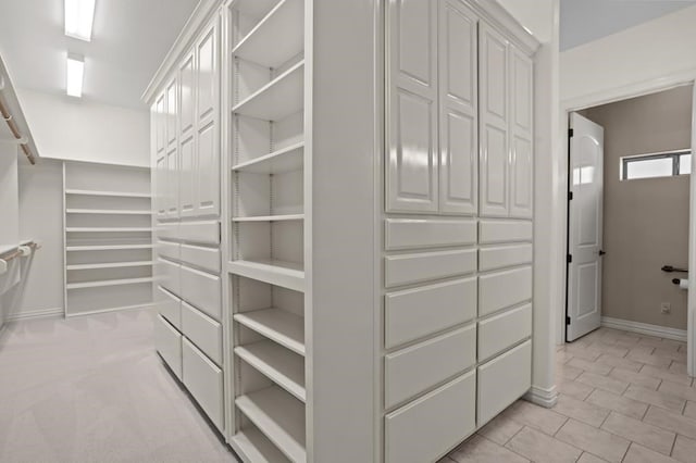 spacious closet with light tile patterned flooring