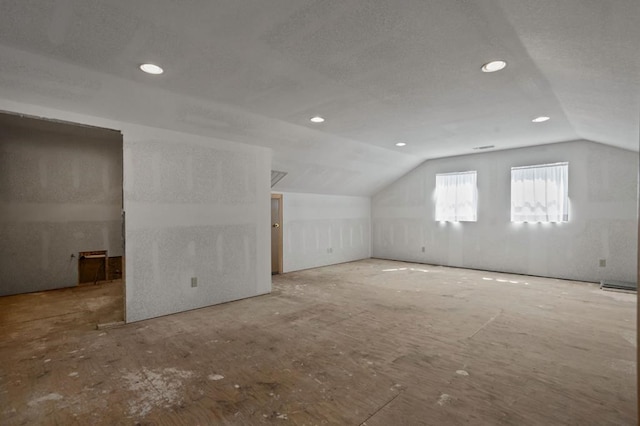 additional living space with vaulted ceiling and recessed lighting