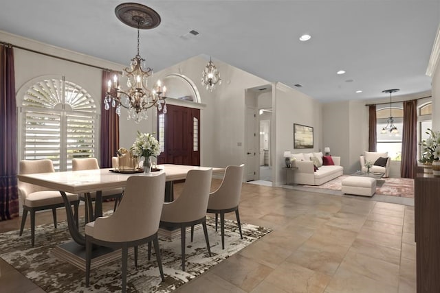 dining space featuring ornamental molding, recessed lighting, visible vents, and a notable chandelier