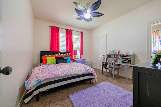 carpeted bedroom featuring ceiling fan