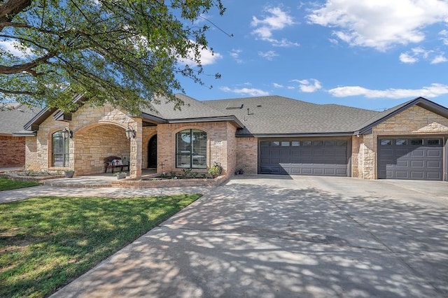 ranch-style house featuring a garage