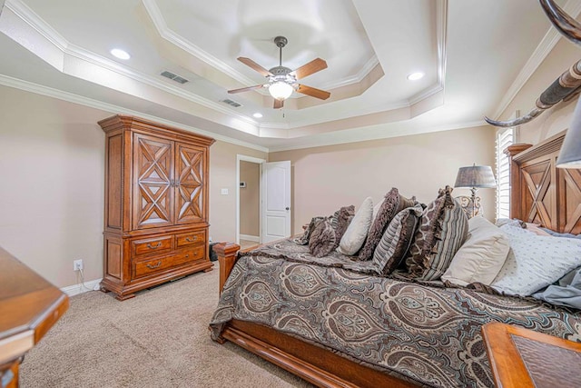 carpeted bedroom featuring ceiling fan, a raised ceiling, and crown molding