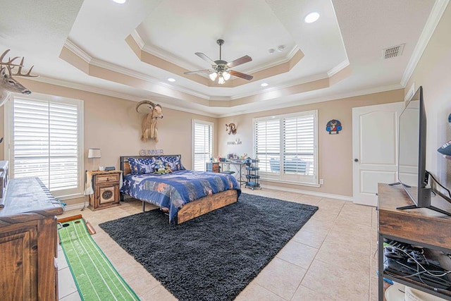 bedroom featuring a raised ceiling, crown molding, ceiling fan, and light tile patterned floors