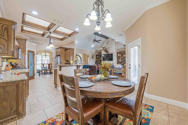 tiled dining area featuring beam ceiling, ceiling fan with notable chandelier, and ornamental molding