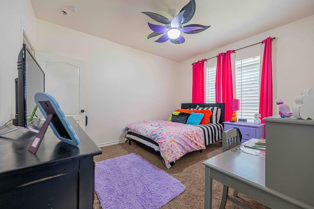 bedroom featuring ceiling fan and dark colored carpet