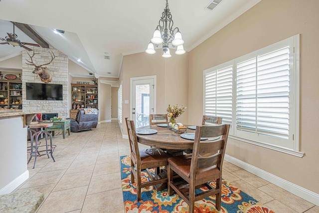 dining space with vaulted ceiling with beams, a fireplace, light tile patterned floors, and ceiling fan with notable chandelier