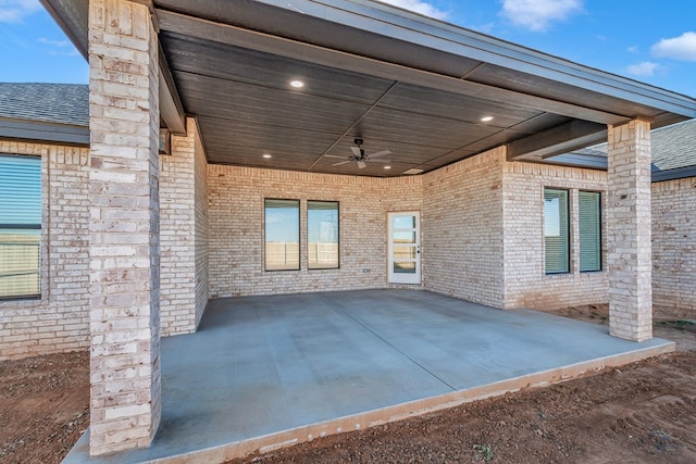 view of patio / terrace featuring a carport and ceiling fan