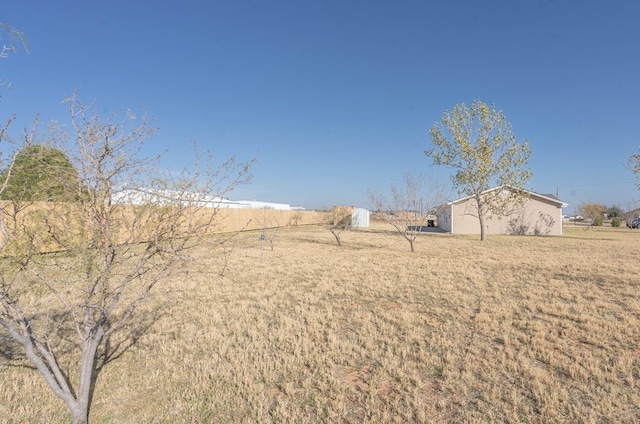 view of yard with a rural view