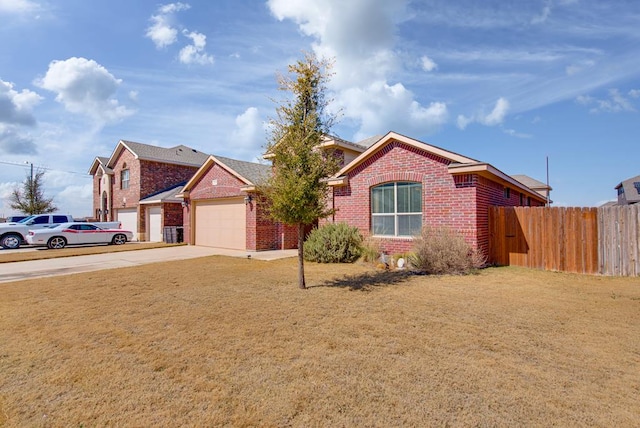 single story home with brick siding, concrete driveway, an attached garage, a front yard, and fence