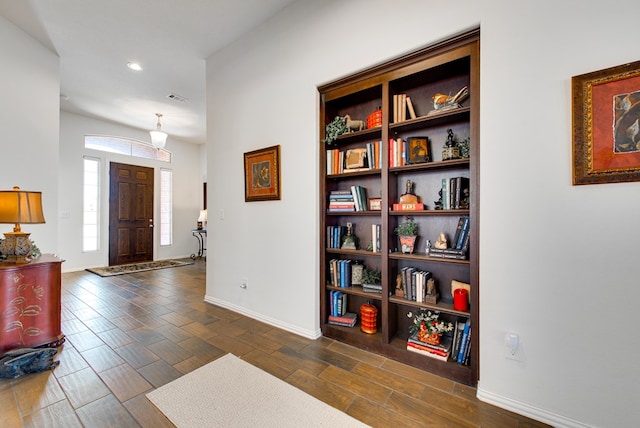 entryway with dark wood-type flooring, recessed lighting, visible vents, and baseboards