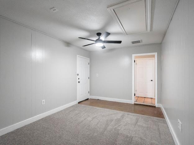10807 E County Rd 104, Midland, TX 79706 - carpeted empty room with attic access and ceiling fan