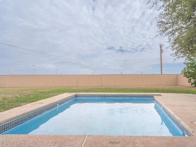 10807 E County Rd 104, Midland, TX 79706 - view of swimming pool with a fenced backyard