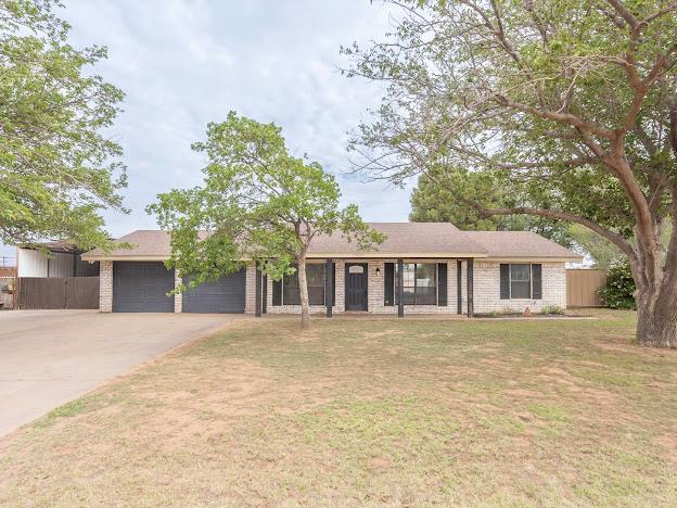 10807 E County Rd 104, Midland, TX 79706 - ranch-style house featuring a garage and driveway