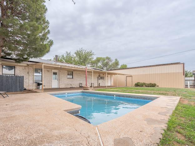 10807 E County Rd 104, Midland, TX 79706 - view of pool featuring a patio