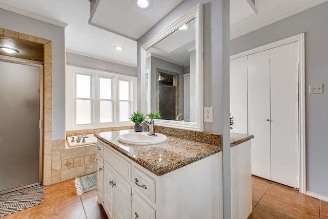 bathroom with recessed lighting, vanity, tile patterned floors, a stall shower, and ornamental molding