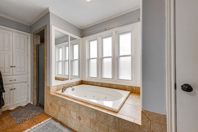 bathroom with tile patterned floors, a stall shower, crown molding, and a whirlpool tub