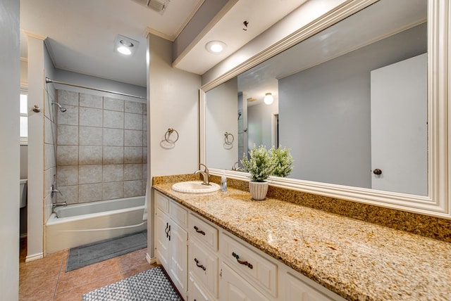 bathroom with tile patterned floors, shower / tub combination, visible vents, and vanity