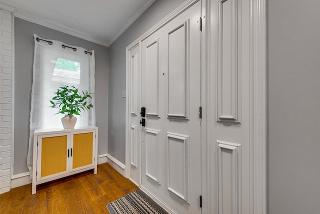 entryway featuring baseboards, ornamental molding, and dark wood-style flooring