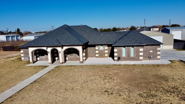 view of community with a yard and a patio