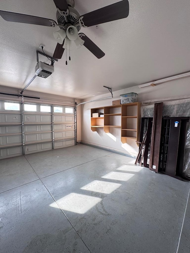 garage with ceiling fan and a garage door opener