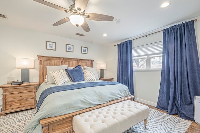 bedroom featuring baseboards, visible vents, a ceiling fan, and recessed lighting