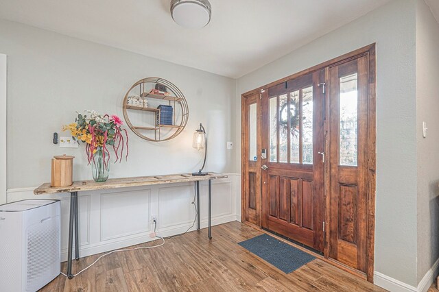 entryway featuring light wood-style floors and baseboards