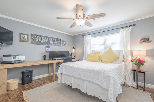 bedroom featuring ornamental molding, dark wood-type flooring, baseboards, and a ceiling fan