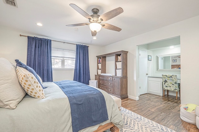 bedroom featuring ceiling fan, recessed lighting, wood finished floors, visible vents, and baseboards