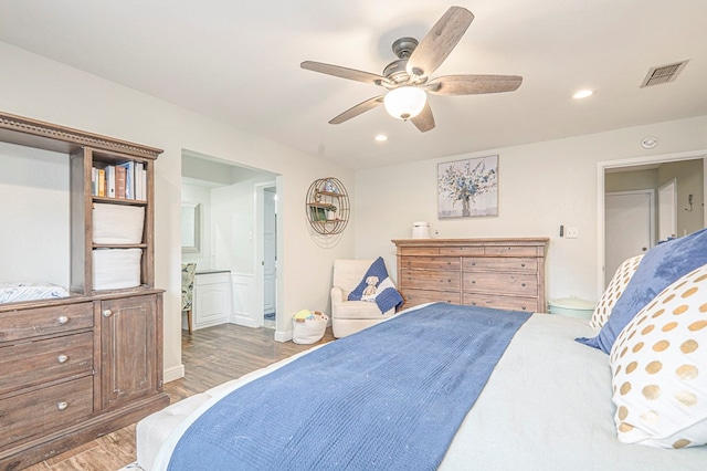 bedroom with visible vents, a ceiling fan, connected bathroom, wood finished floors, and recessed lighting