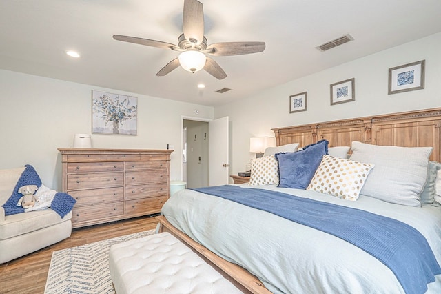 bedroom featuring light wood-type flooring, visible vents, and recessed lighting