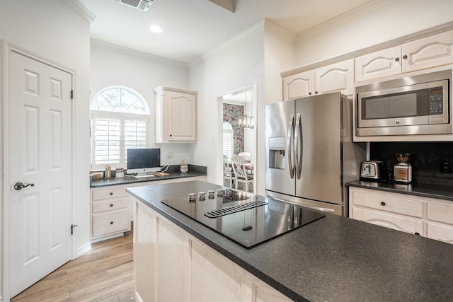 kitchen with crown molding, light hardwood / wood-style flooring, and stainless steel appliances