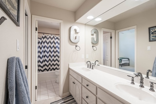 full bathroom with vanity, toilet, tile patterned floors, and shower / bath combo