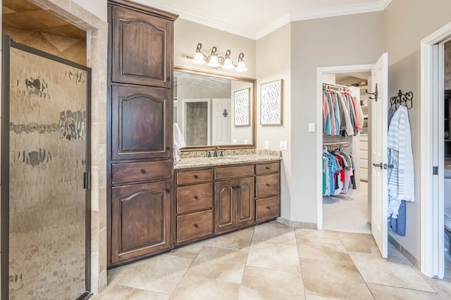 bathroom with walk in shower, ornamental molding, and vanity