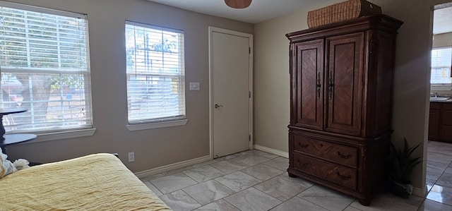 entryway with ceiling fan and a healthy amount of sunlight