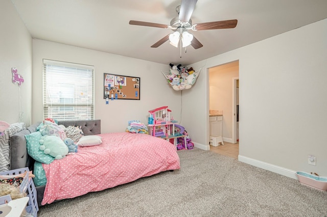 carpeted bedroom with ceiling fan and connected bathroom